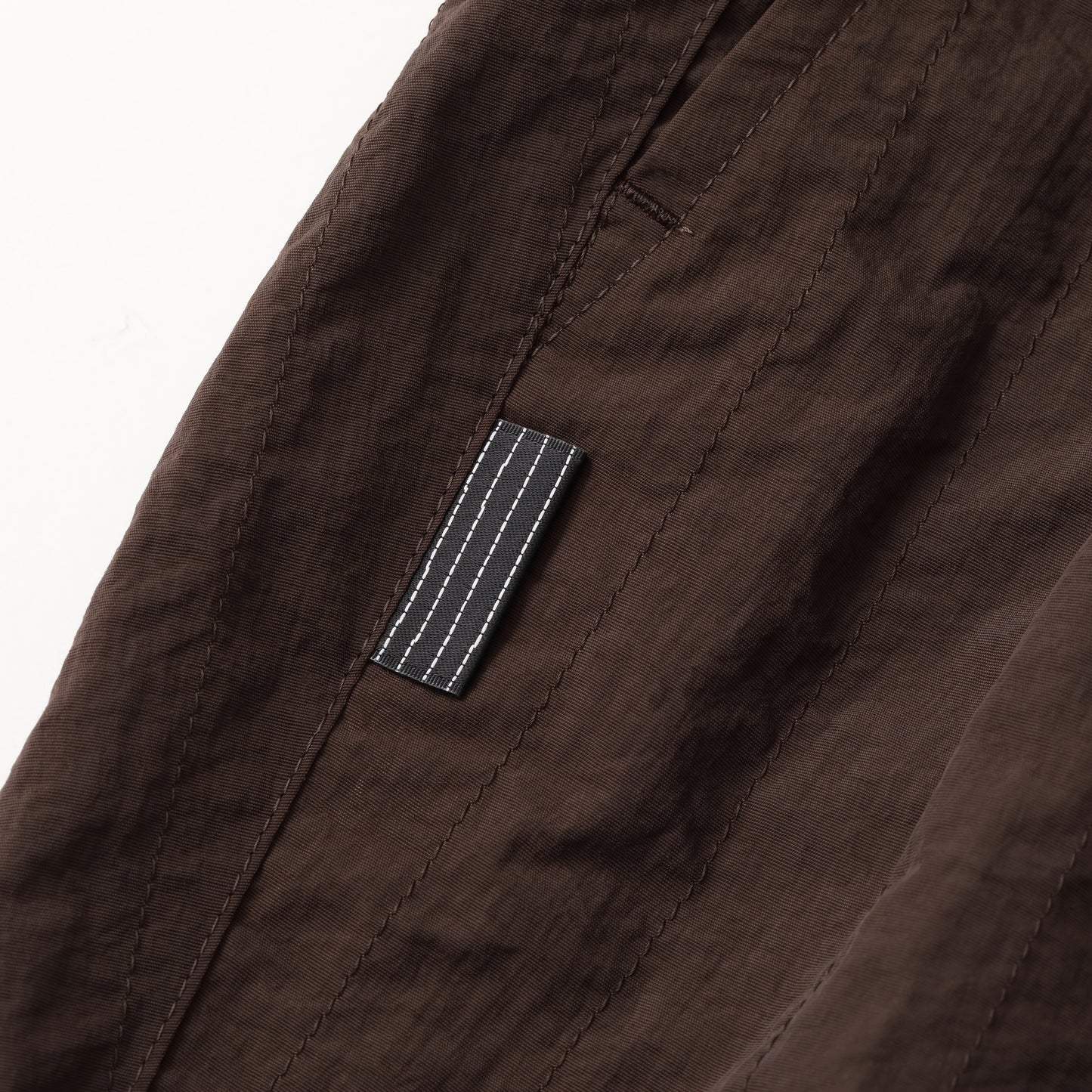 S.F.C NEW WIDE TWO TUCK PANTS (STITCHED NYLON) D BROWN【SFCFW25P06】(N)