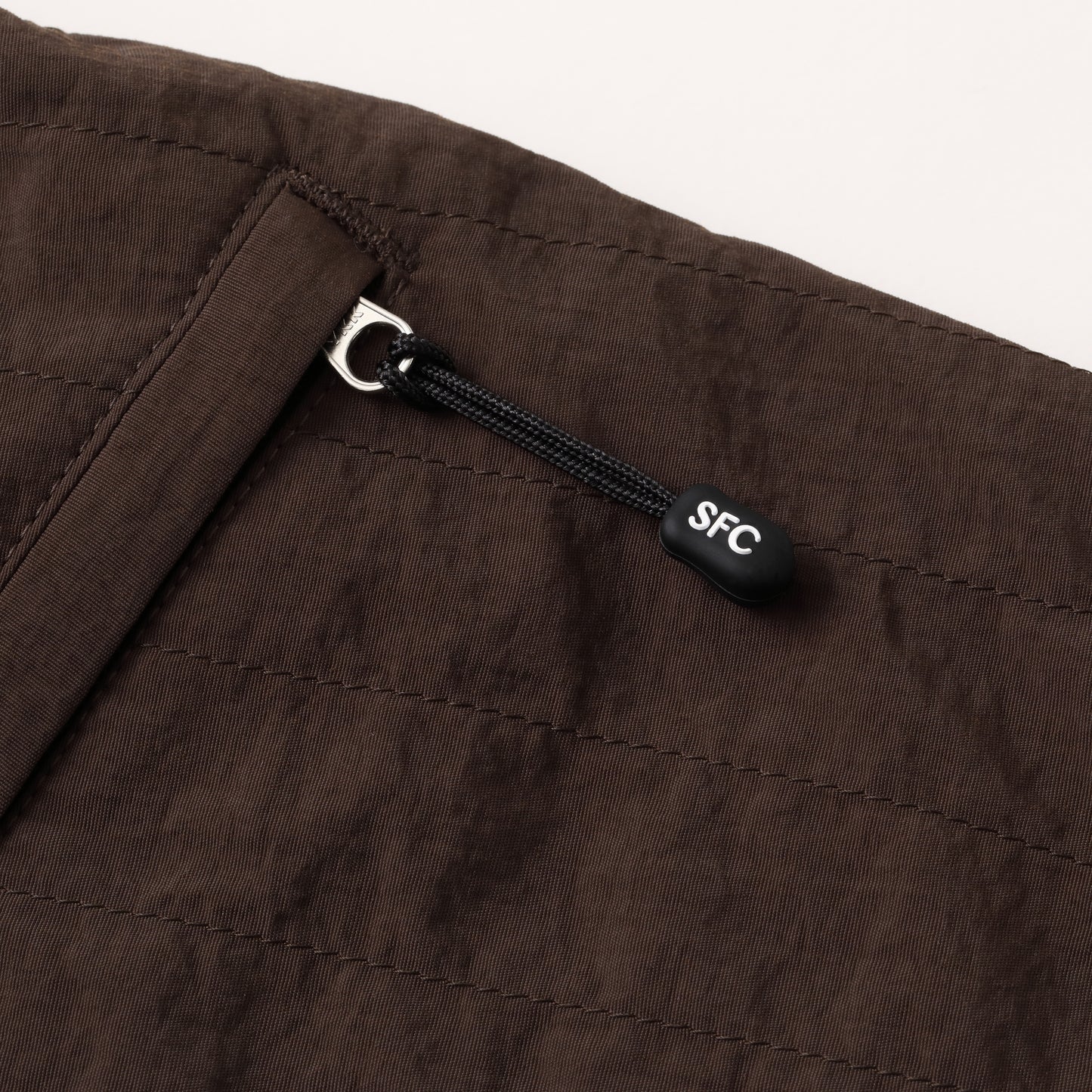 S.F.C NEW WIDE TWO TUCK PANTS (STITCHED NYLON) D BROWN【SFCFW25P06】(N)